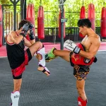 Muay Thai training in Koh Samui gym with fighters sparring – authentic Thai boxing experience in Thailand.
