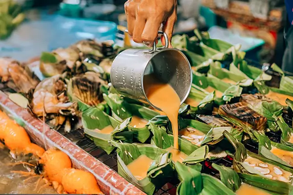 Food stall at Koh Samui night market with traditional Thai street food and vibrant local flavors.